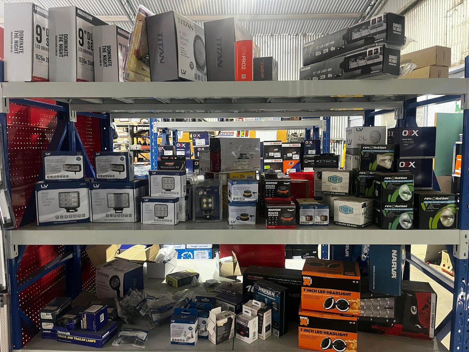 Shelves of auto electrical parts and workshop stock